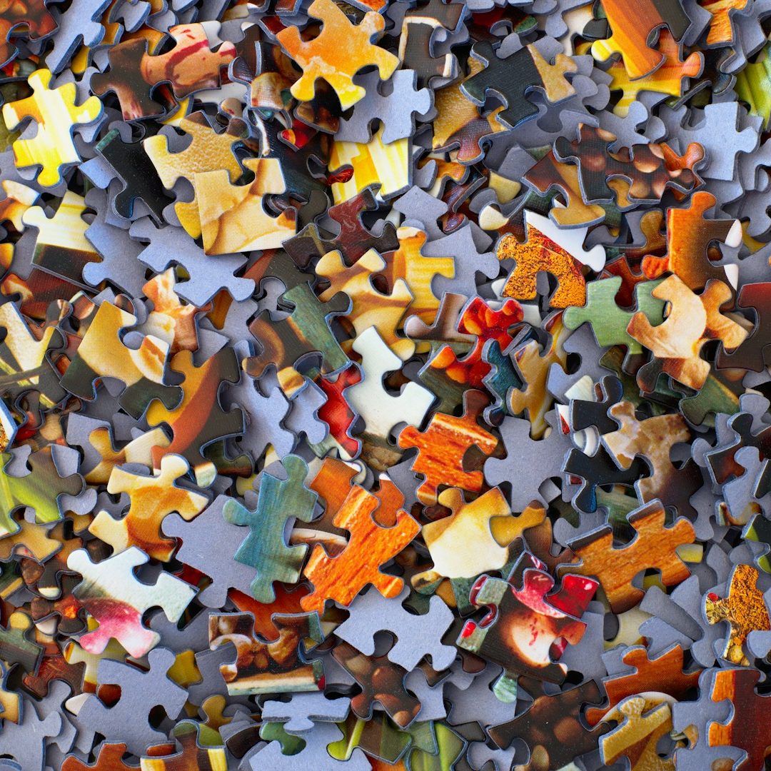 From Chaos to Clarity Image shows a pile of jigsaw puzzle pieces
